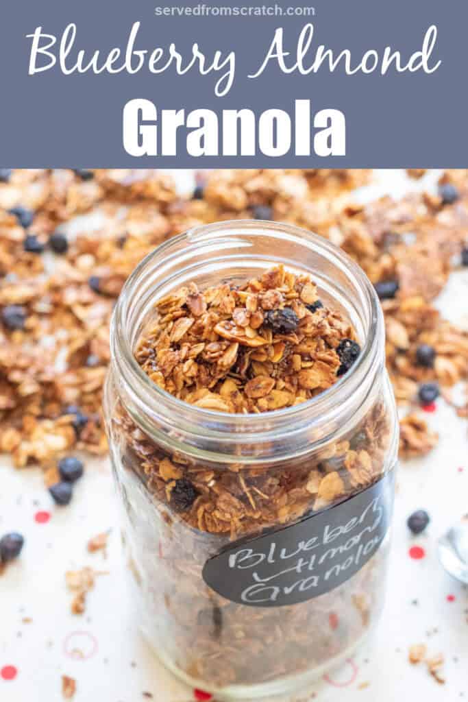a picture of an open labeled mason jar of blueberry almond granola with Pinterest pin text.