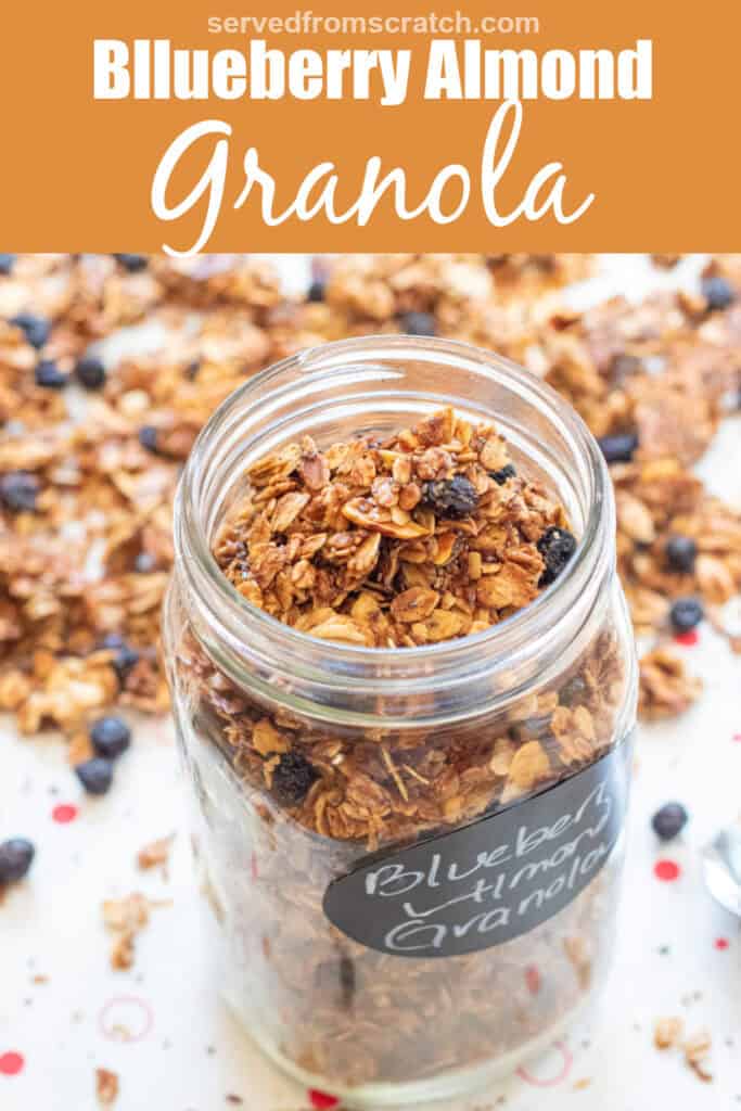 a picture of an open labeled mason jar of blueberry almond granola with Pinterest pin text.