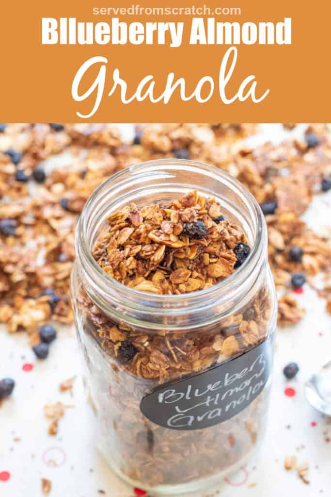 a picture of an open labeled mason jar of blueberry almond granola with Pinterest pin text.