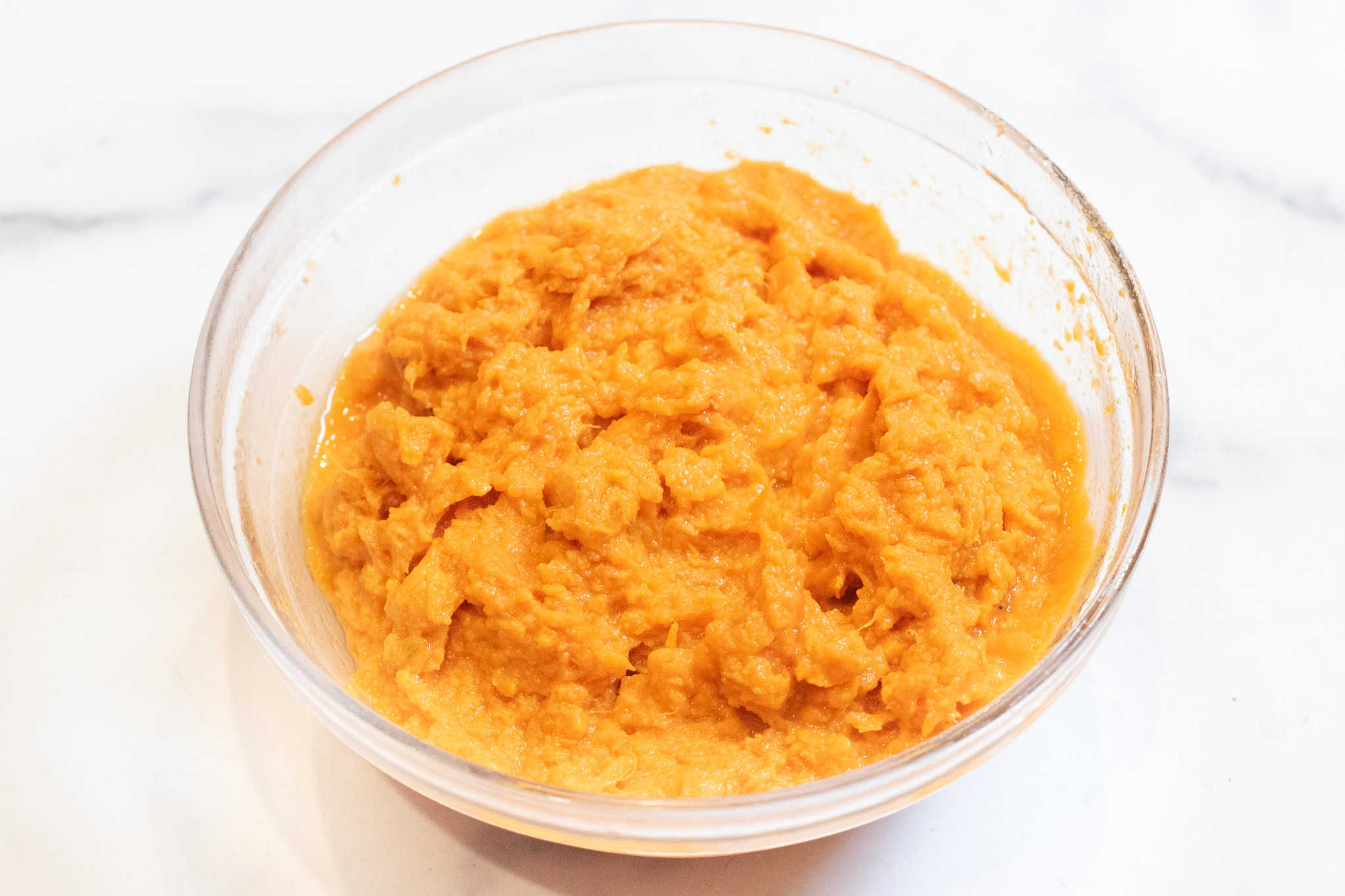 a bowl of mashed sweet potato in a bowl.