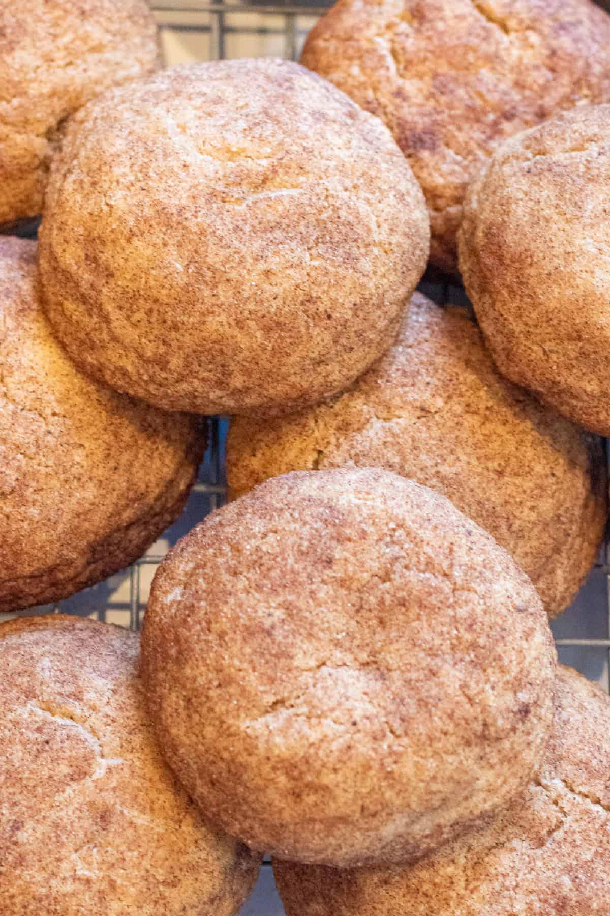 thick soft snickerdoodle cookies all stacked together.