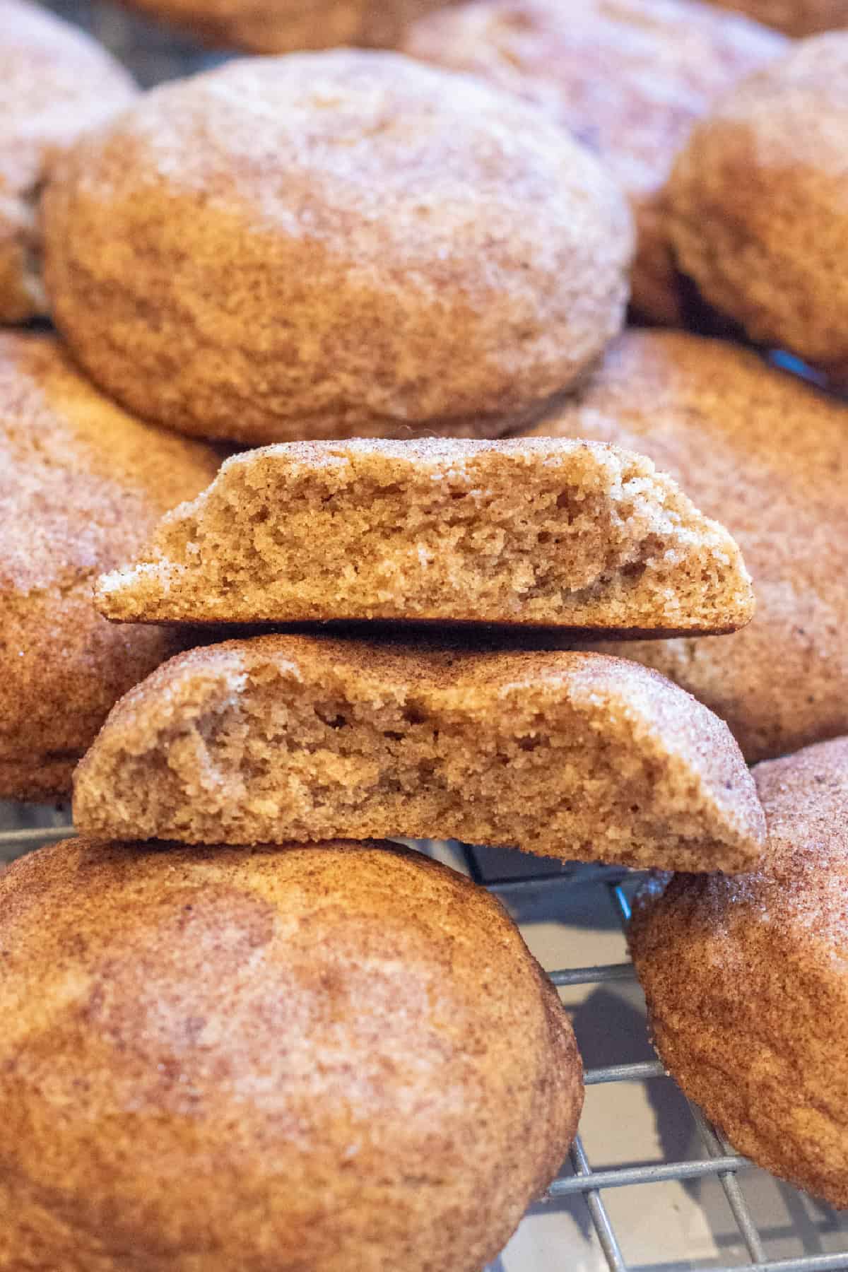 a halved cookie on top of other cookies.