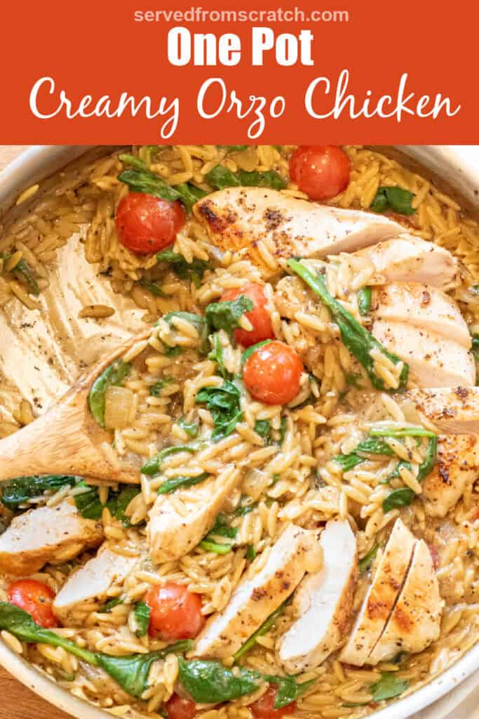 an overhead of a skillet with cooked sliced chicken and orzo and spinach and tomatoes with a wooden spoon with Pinterest pin text.