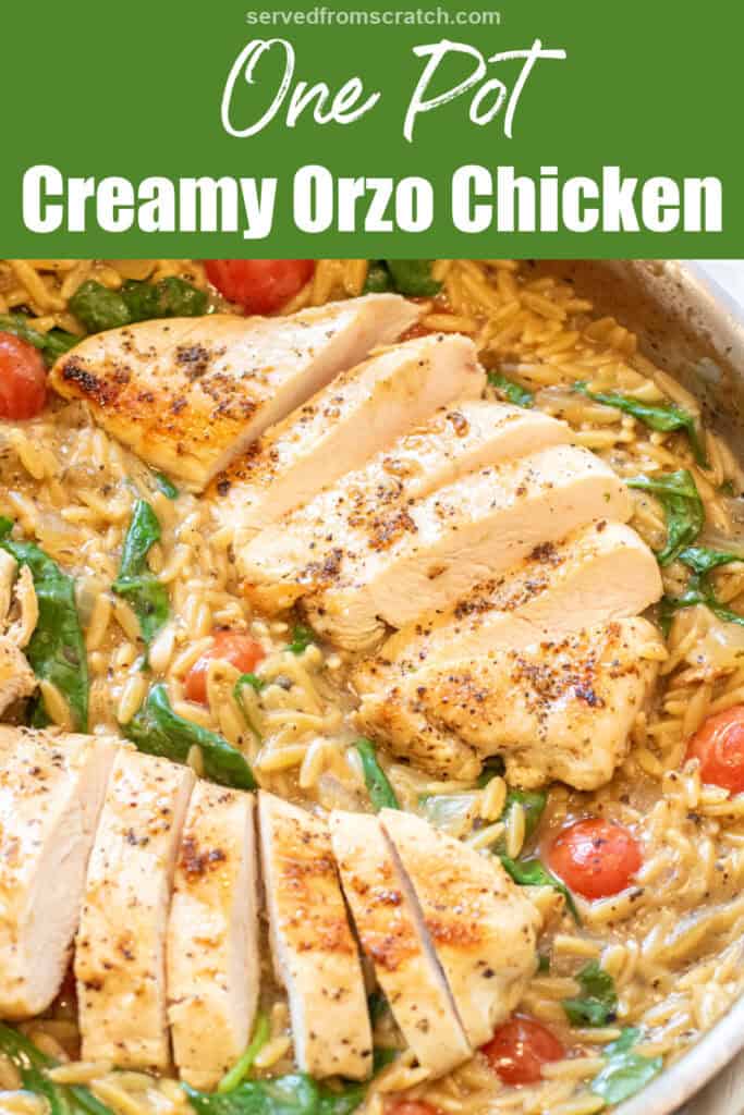an overhead of a skillet with cooked sliced chicken and orzo and spinach and tomatoes with Pinterest pin text.