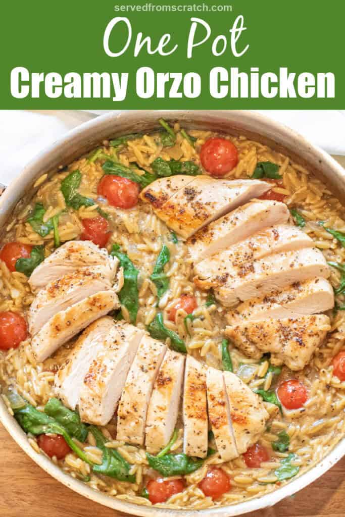 an overhead of a skillet with cooked sliced chicken and orzo and spinach and tomatoes with Pinterest pin text.