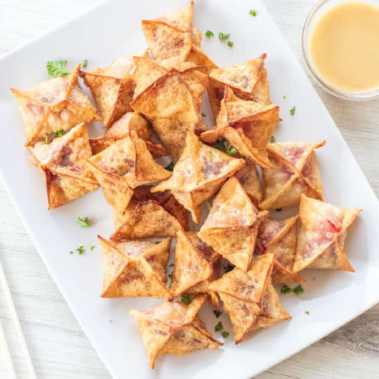 a plate of crispy wontons.