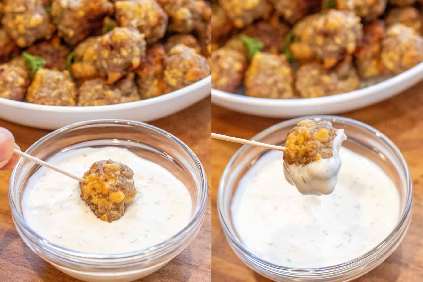 a hand with a toothpick dipping a sausage ball into ranch and then holding it up. 