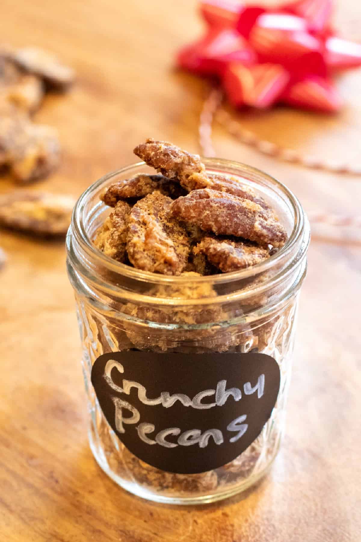 a small mason jar of crunchy pecans.