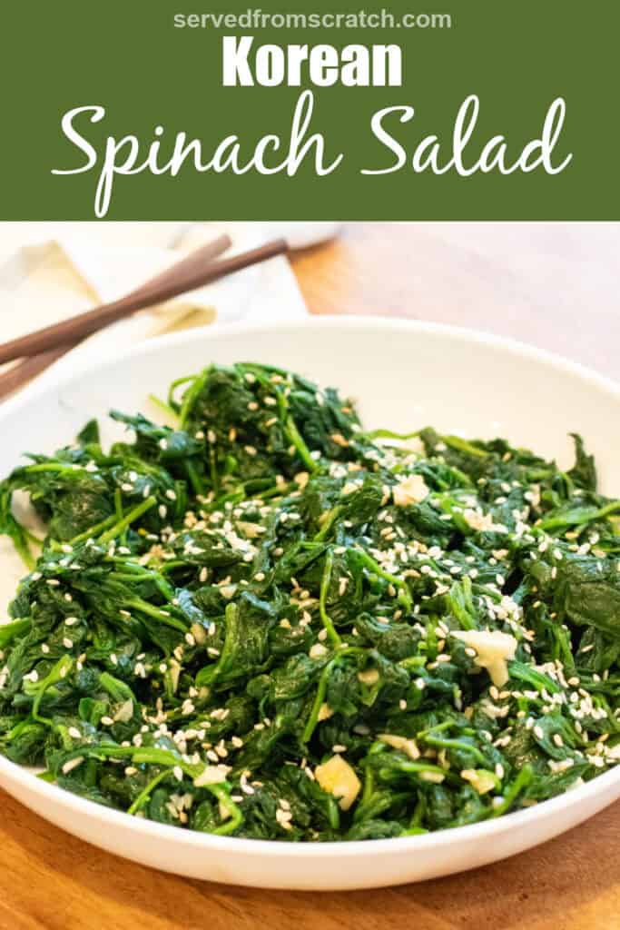 a bowl of blanched spinach with garlic and sesame seeds and chopsticks with Pinterest pin text.