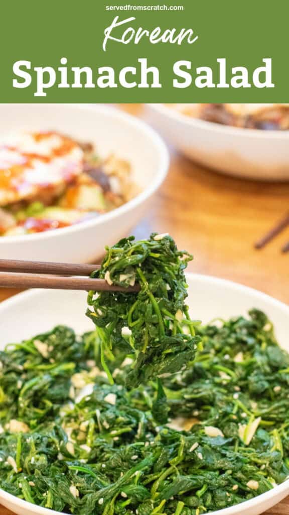 a bowl of blanched spinach with garlic and sesame seeds and some held up by chopsticks with Pinterest pin text.