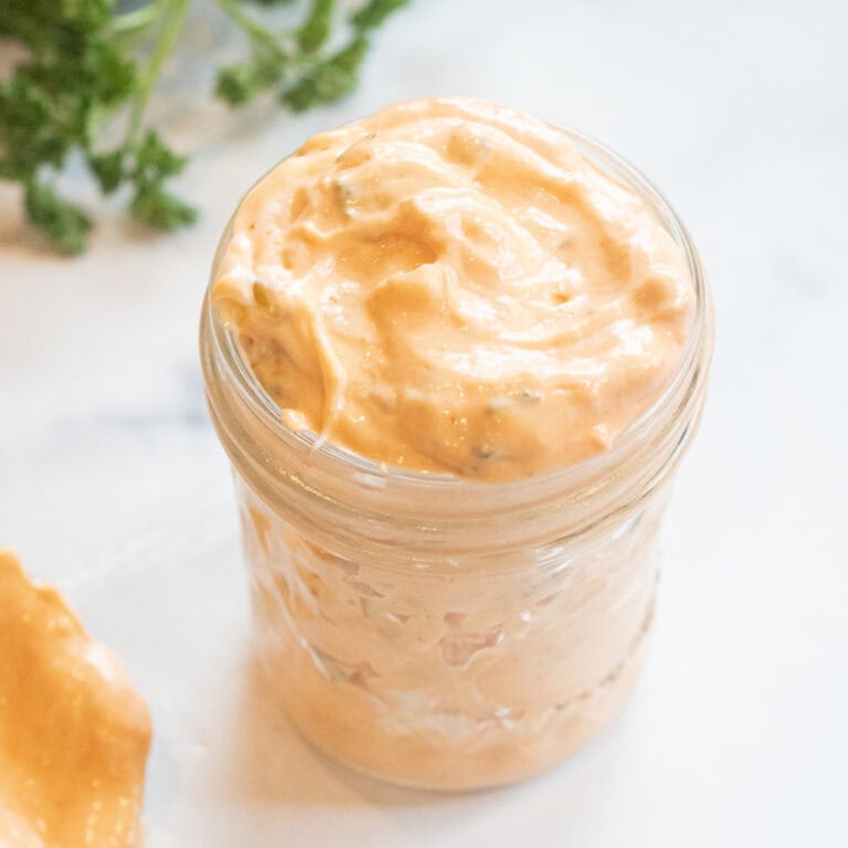 a small mason jar of creamy dressing.