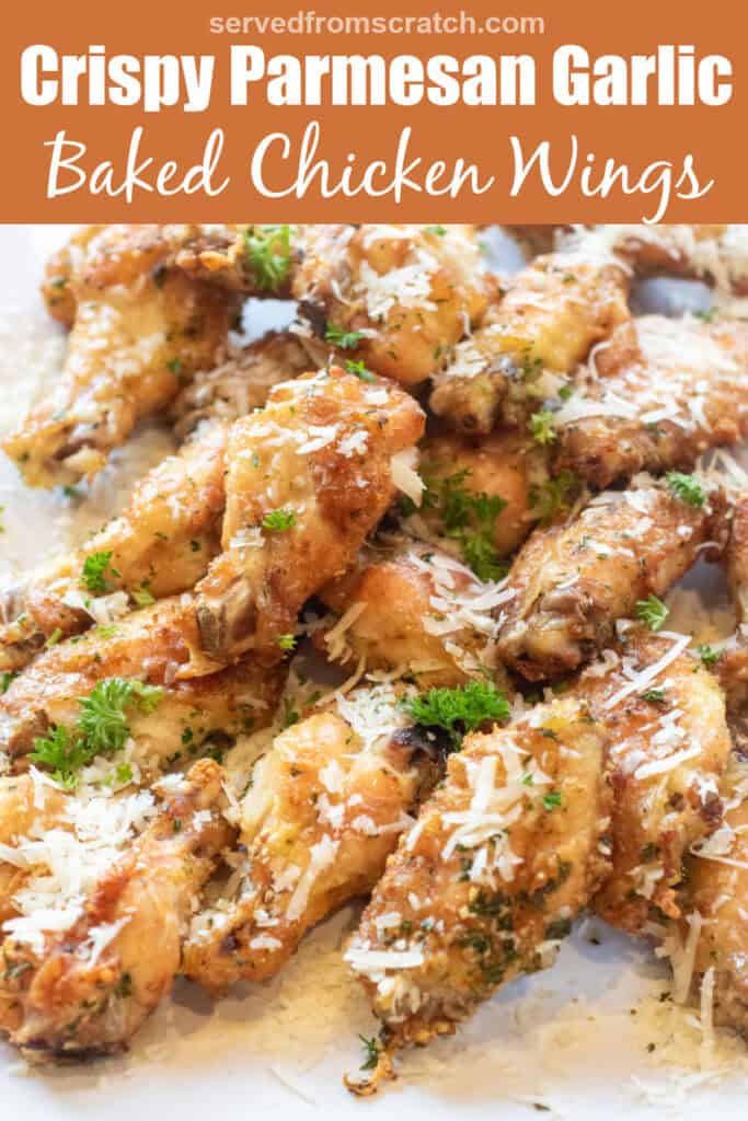 a plate of baked chicken wings with parsley and parmesan sprinkled on top with Pinterest pin text.
