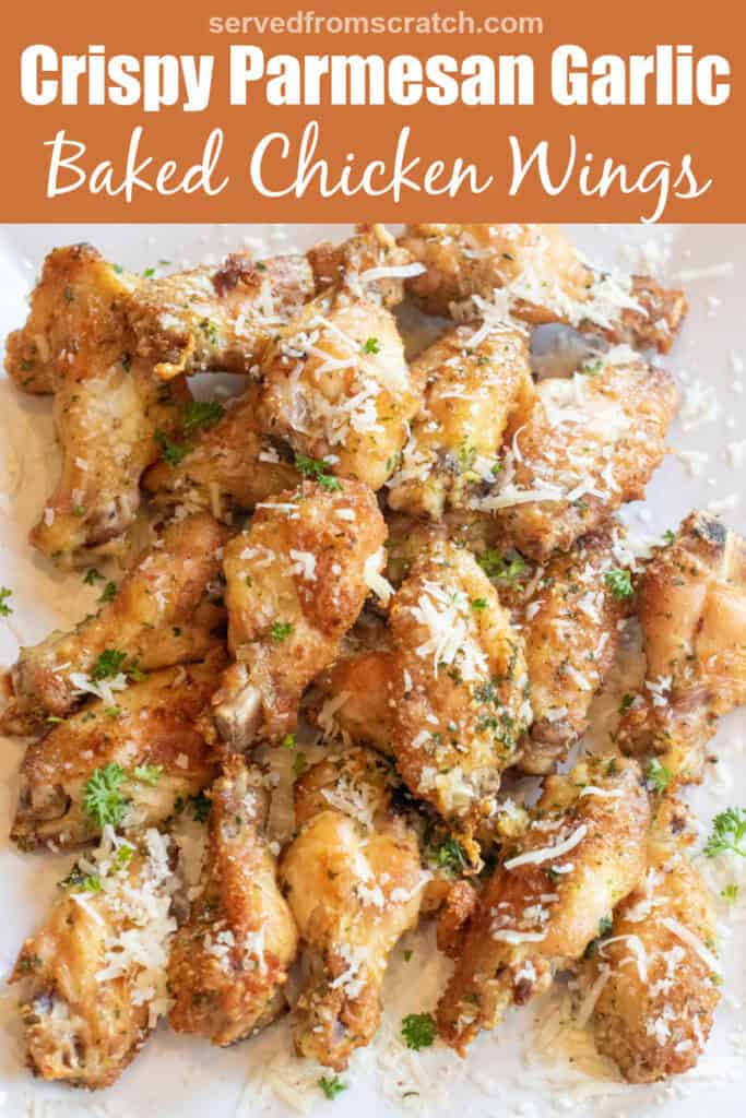 a plate of baked chicken wings with parsley and parmesan sprinkled on top with Pinterest pin text.