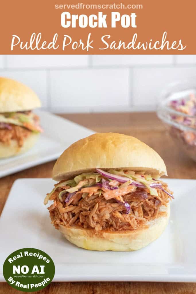 a close up of a pulled pork sandwich on a brioche bun on a plate with coleslaw with Pinterest pin text with NO AI sticker.