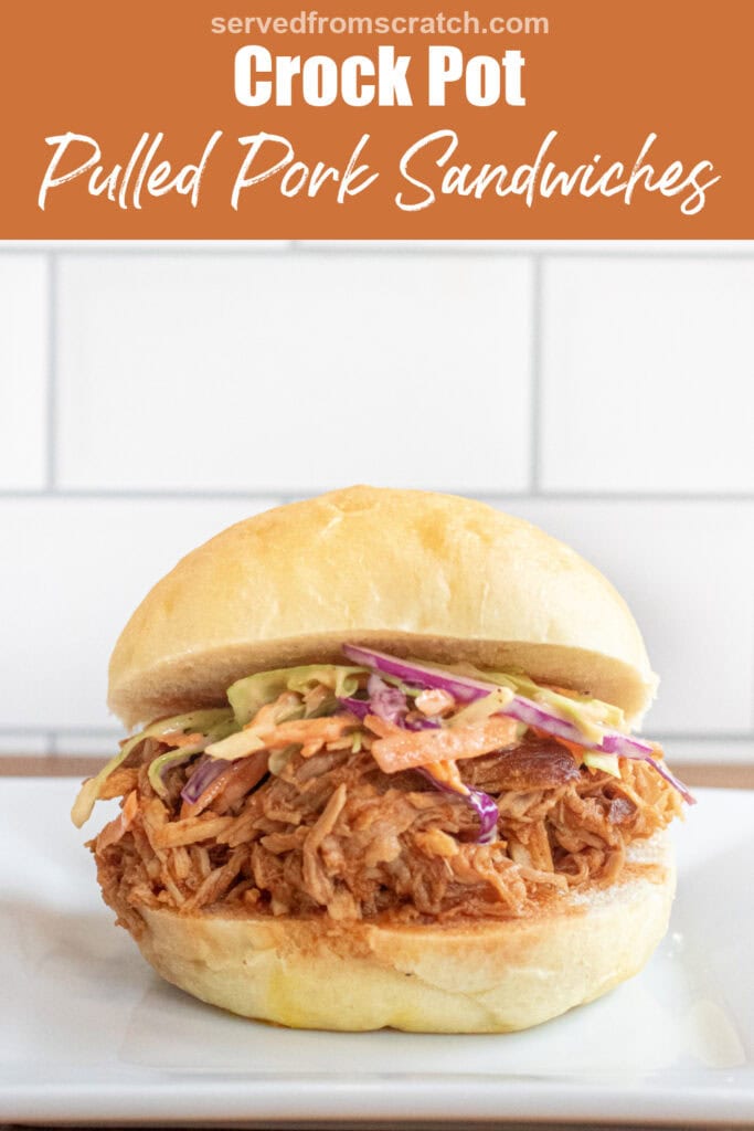 a close up of a pulled pork sandwich on a brioche bun on a plate with coleslaw with Pinterest pin text.