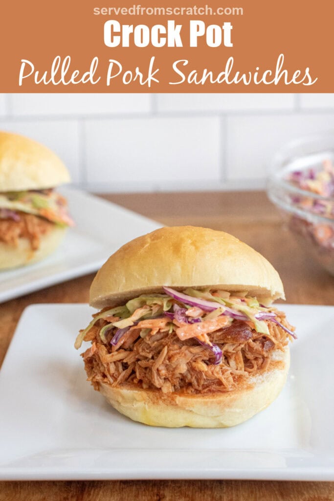 a close up of a pulled pork sandwich on a brioche bun on a plate with coleslaw with Pinterest pin text.