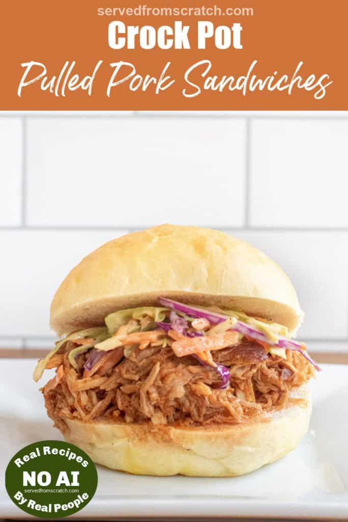a close up of a pulled pork sandwich on a brioche bun on a plate with coleslaw with Pinterest pin text with NO AI sticker.