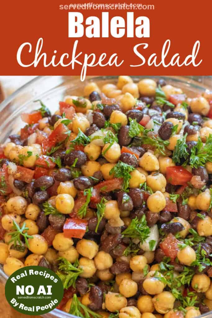 a salad with chickpeas black beans, tomatoes, and parsley with Pinterest pin text and NO AI sticker.