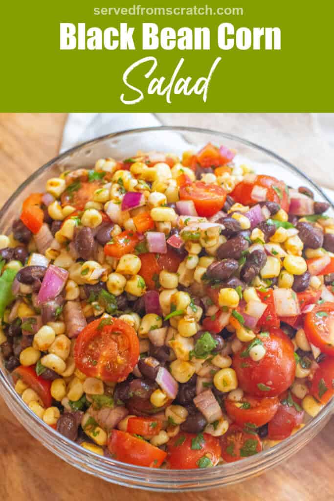 a large bowl of a corn and black bean salad with halved tomatoes and herbs with Pinterest pin text.