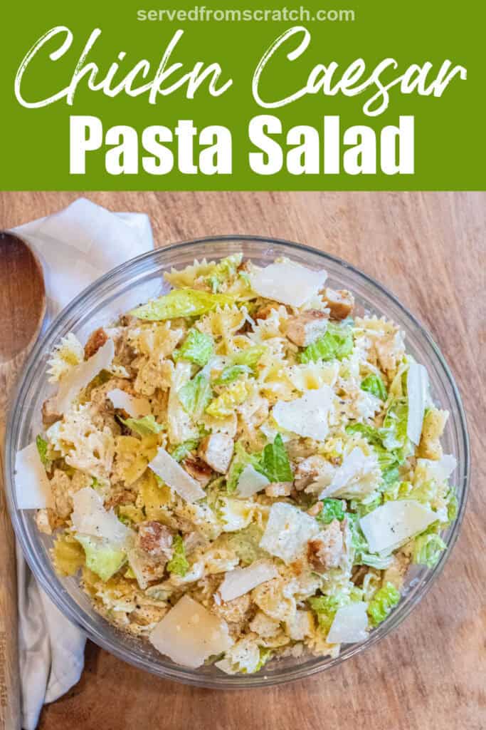 an overhead of a pasta salad with lettuce, chicken, croutons, and cheese and Pinterest pin text.