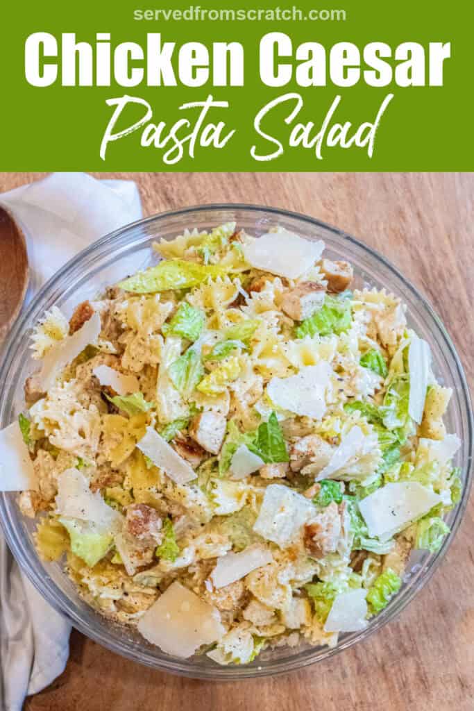 an overhead of a pasta salad with lettuce, chicken, croutons, and cheese and Pinterest pin text.