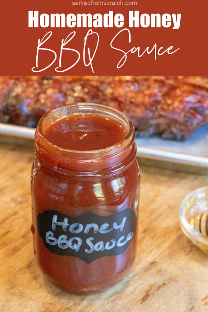 an open jar of honey bbq sauce in front of a tray of ribs with Pinterest pin text.