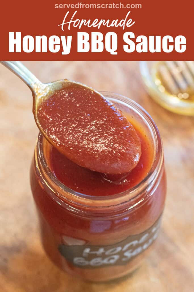 an open jar of honey bbq sauce with a spoon in front of a tray of ribs with Pinterest pin text.