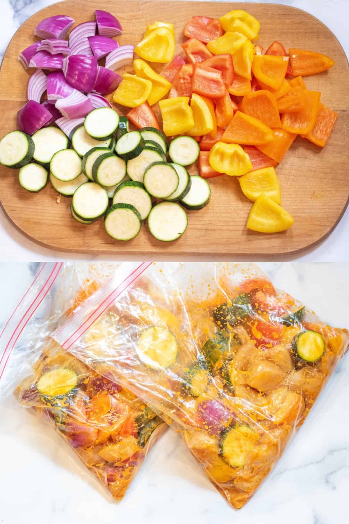 a cutting board with chopped veggies and bags of marinating chicken and veggies.
