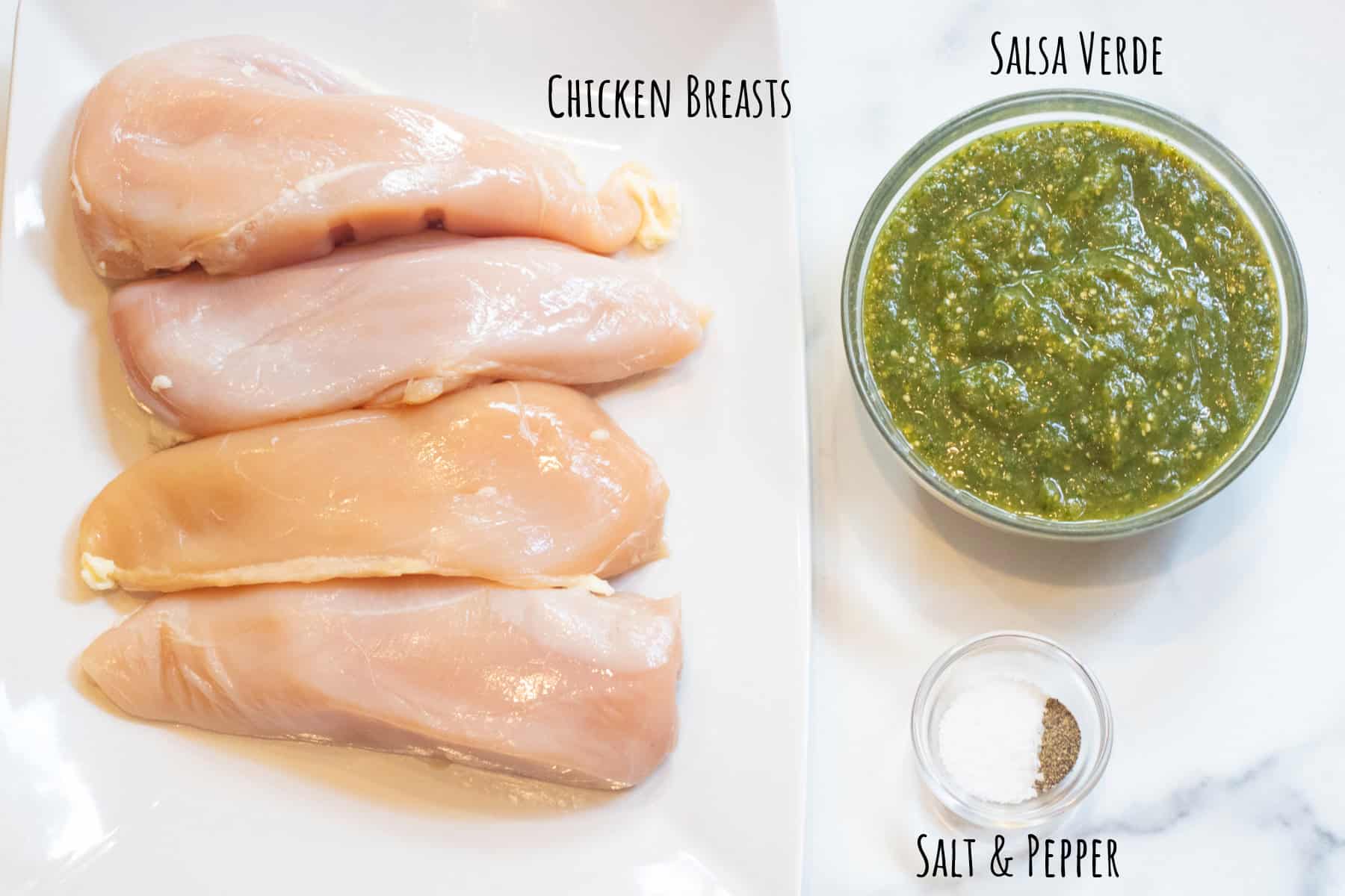 raw chicken breasts, a bowl of salsa verde, and a bowl of salt and pepper labeled.