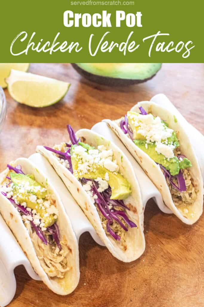 three tacos with shredded chicken, cabbage, avocado, and cotija with Pinterest pin text.