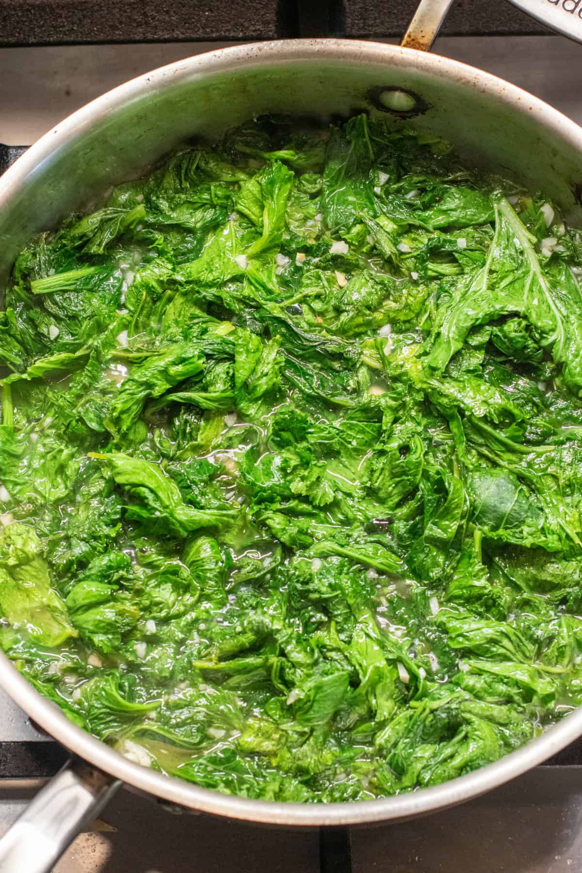 a pan of cooked mustard greens.