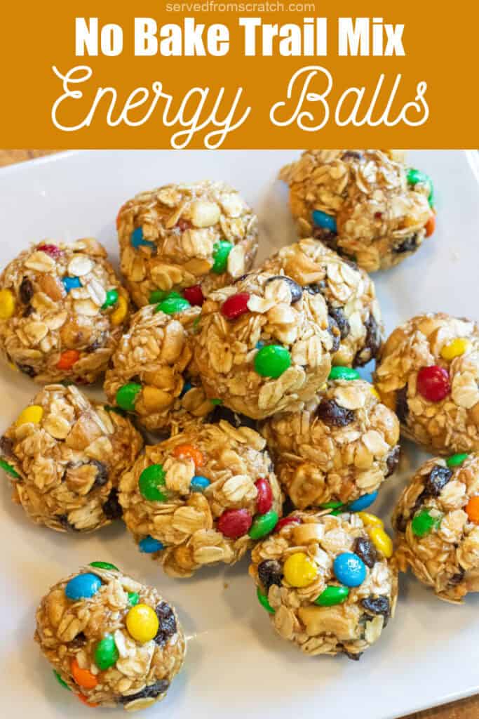 a tray of oat balls with raisins and m&ms with Pinterest pin text.