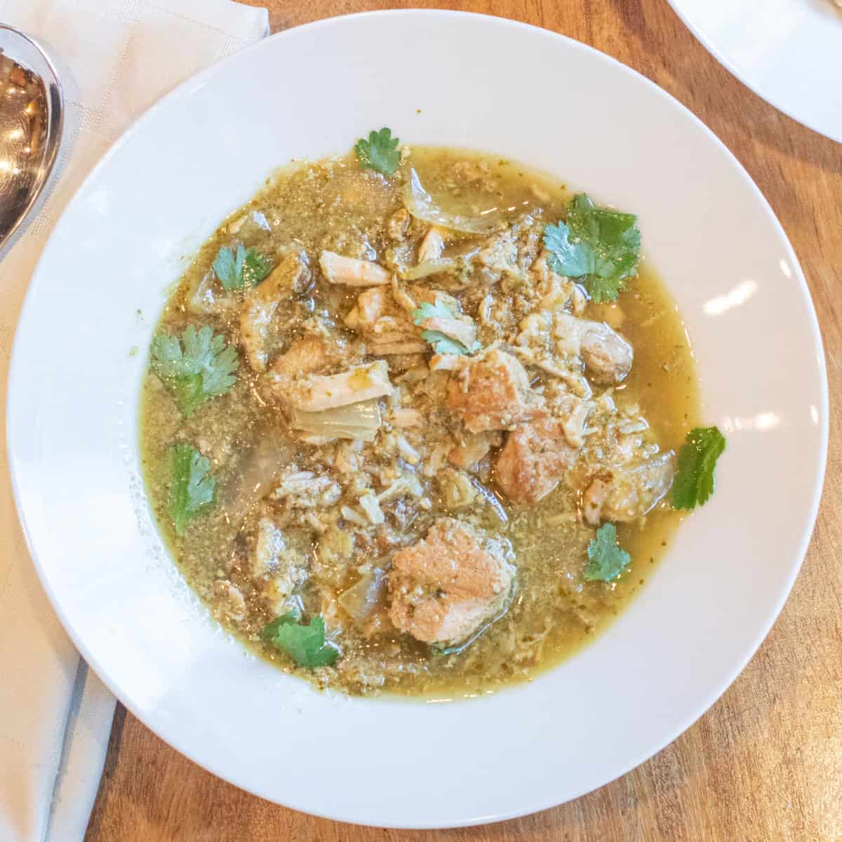 an overhead of a bowl of chili pork verde.