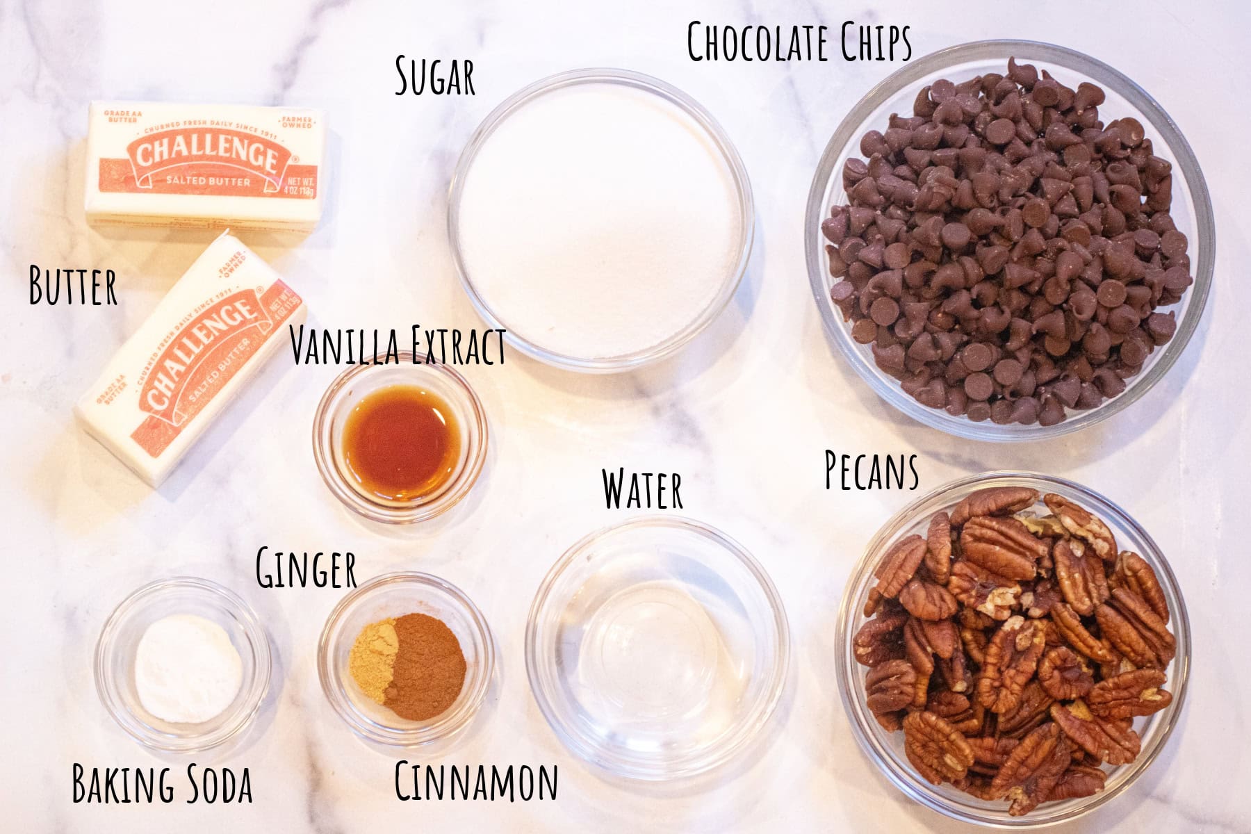 butter, pecans, chocolate chips, spices, sugar, vanilla extract all labeled.