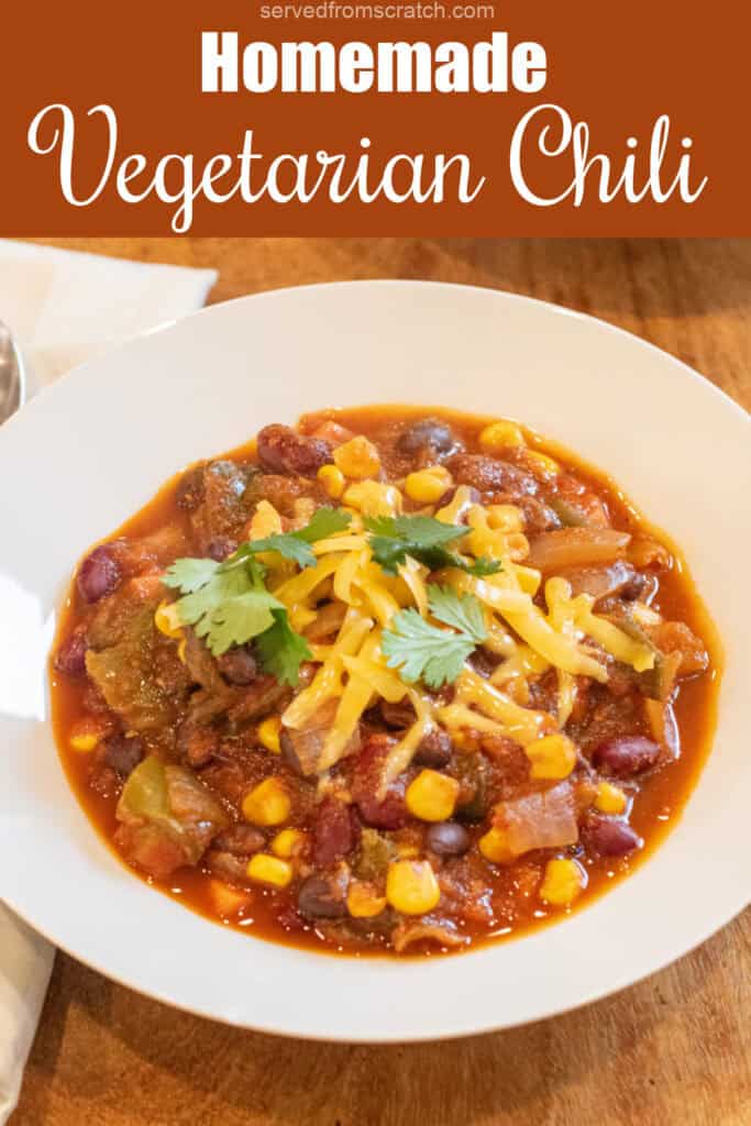 a bowl of chili with cheese and cilantro with Pinterest pin text.