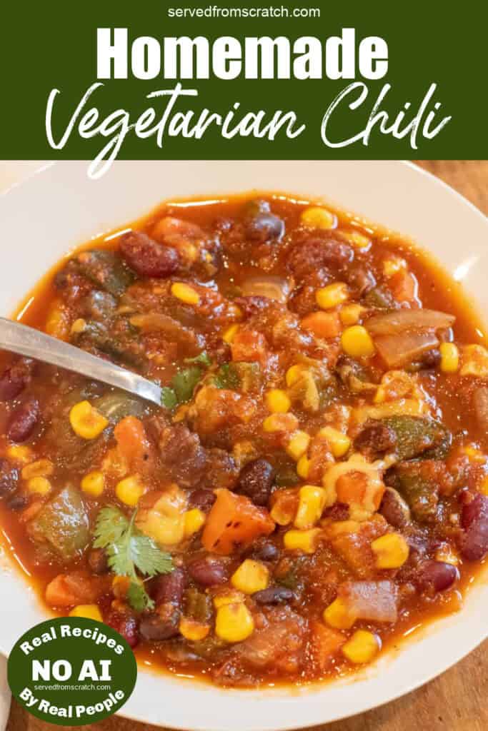 a bowl of vegetarian chili with a spoon and Pinterest pin text and NO AI sticker.