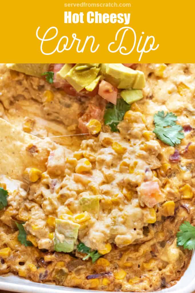 a chip dipping into cheesy corn dip with Pinterest pin text.