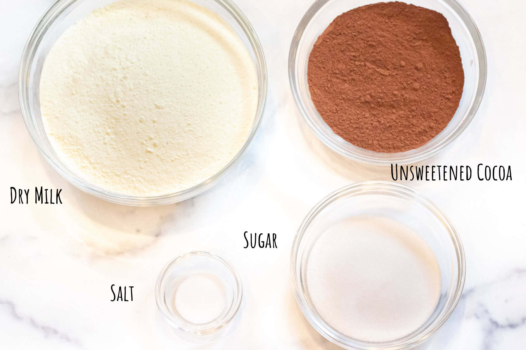 bowls of dry milk, cocoa, salt, and sugar labeled.