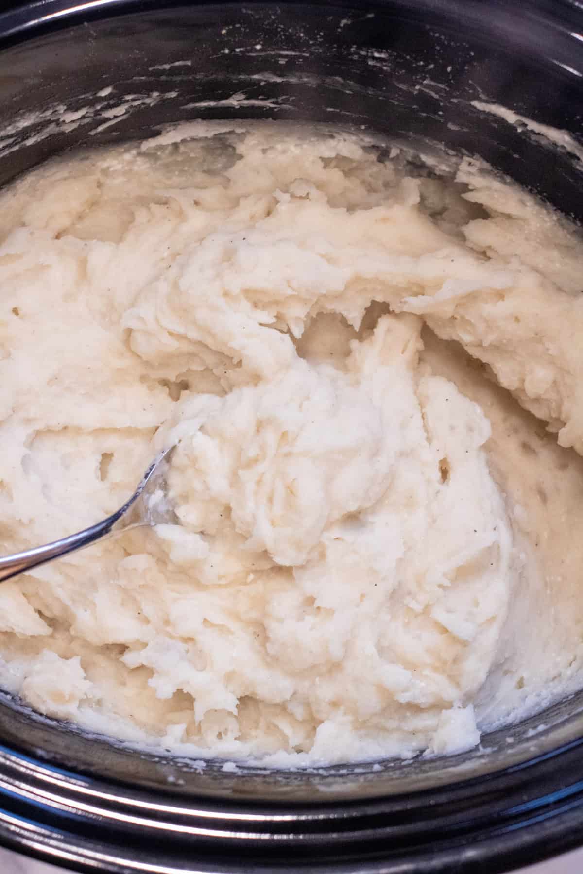 a crock pot of creamy mashed potatoes.