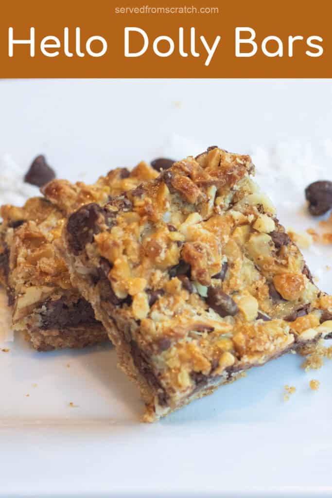 a plate with two stacked layered coconut and chocolate cookie bars and Pinterest pin text.