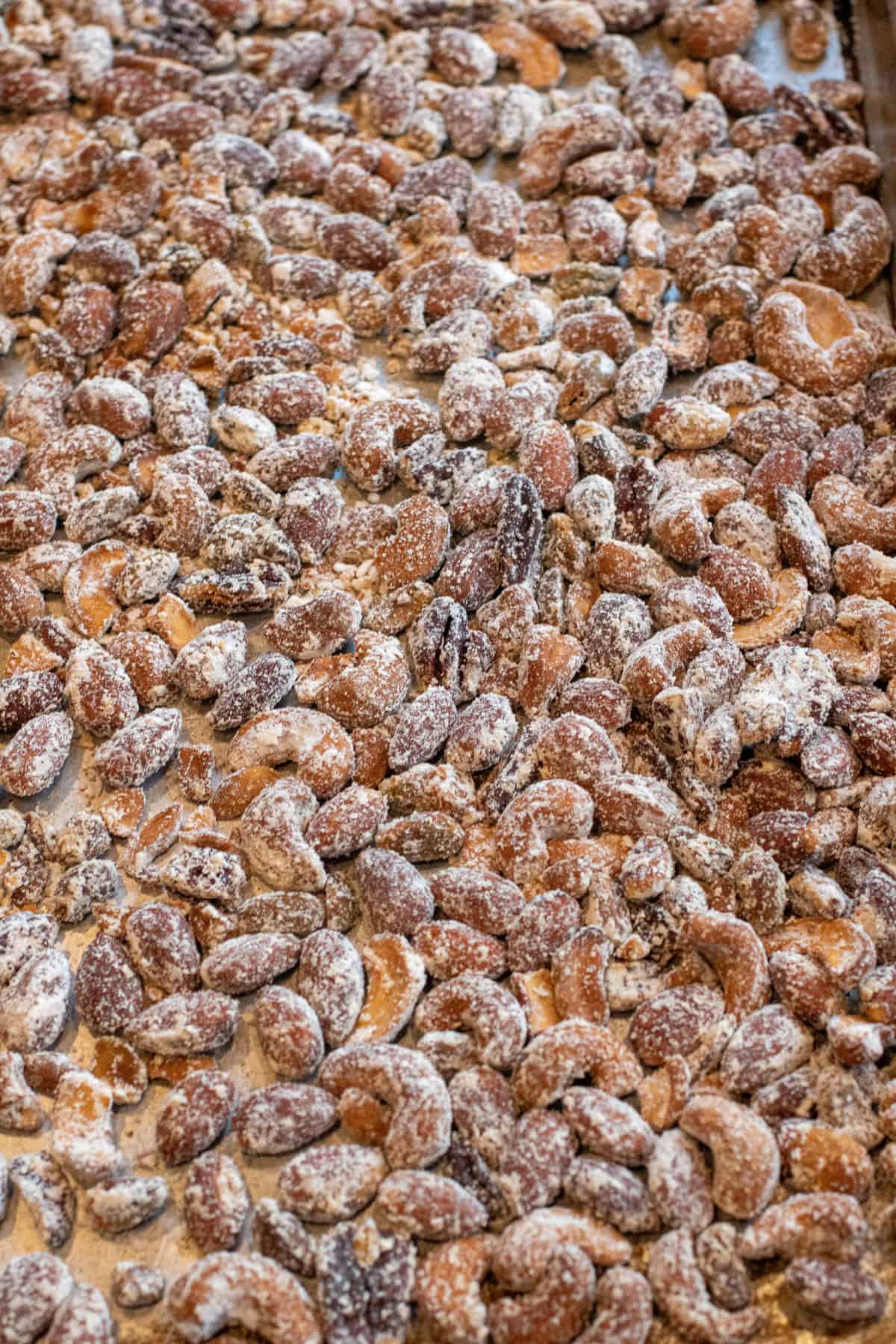 a tray of vinegar powder coated nuts on a tray.