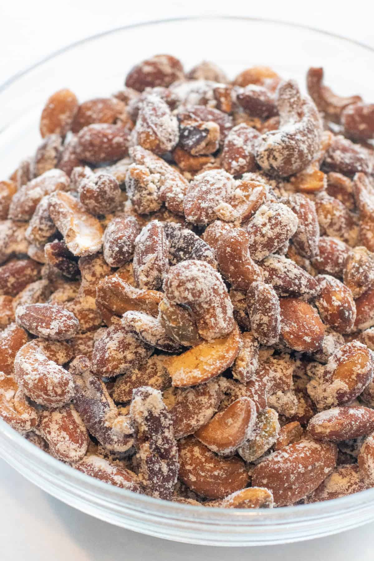 a bowl of mixed nuts with vinegar powder in a bowl.
