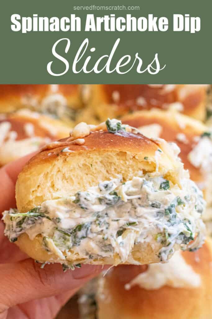 a hand holding a spinach artichoke dip stuffed slider and Pinterest pin text.