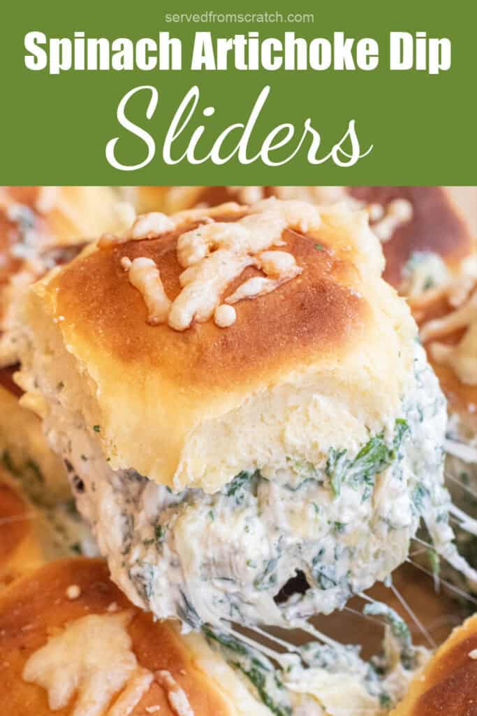 a cheesy slider filled with spinach artichoke dip with Pinterest pin text.