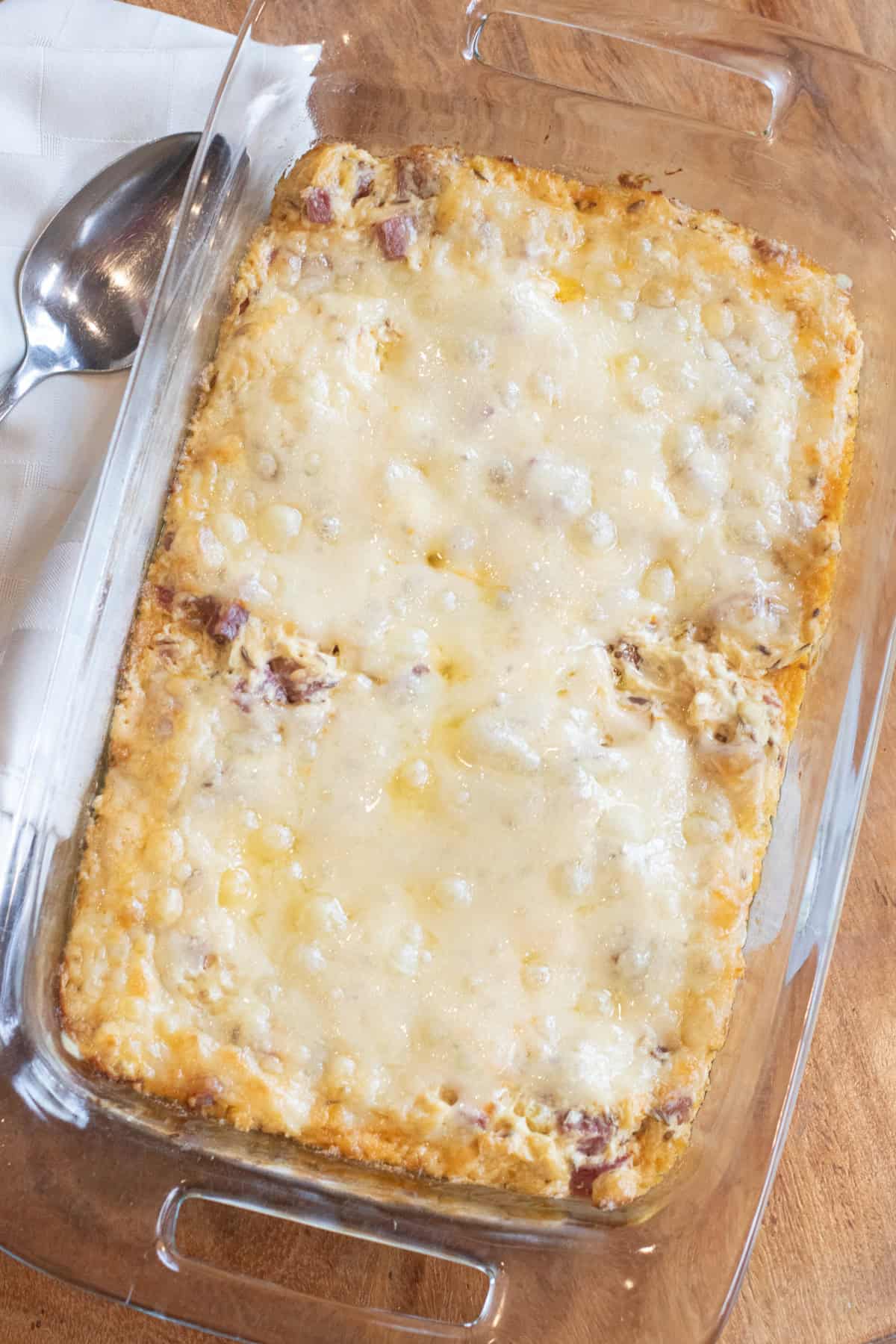 a baking tray with dip and then melted cheese on top.