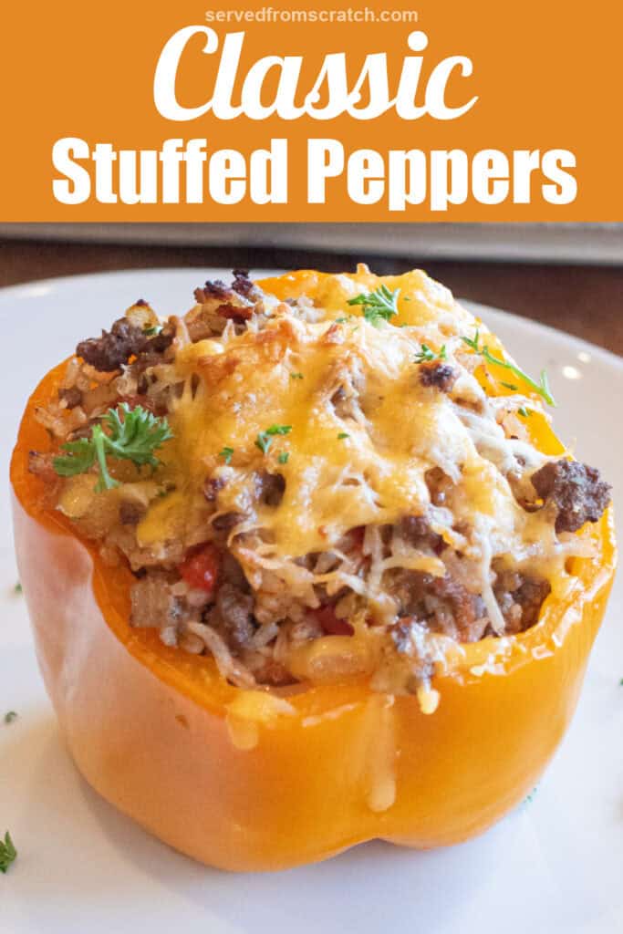 a stuffed pepper on a plate baked with cheese on top in front of a baking dish and Pinterest pin text.