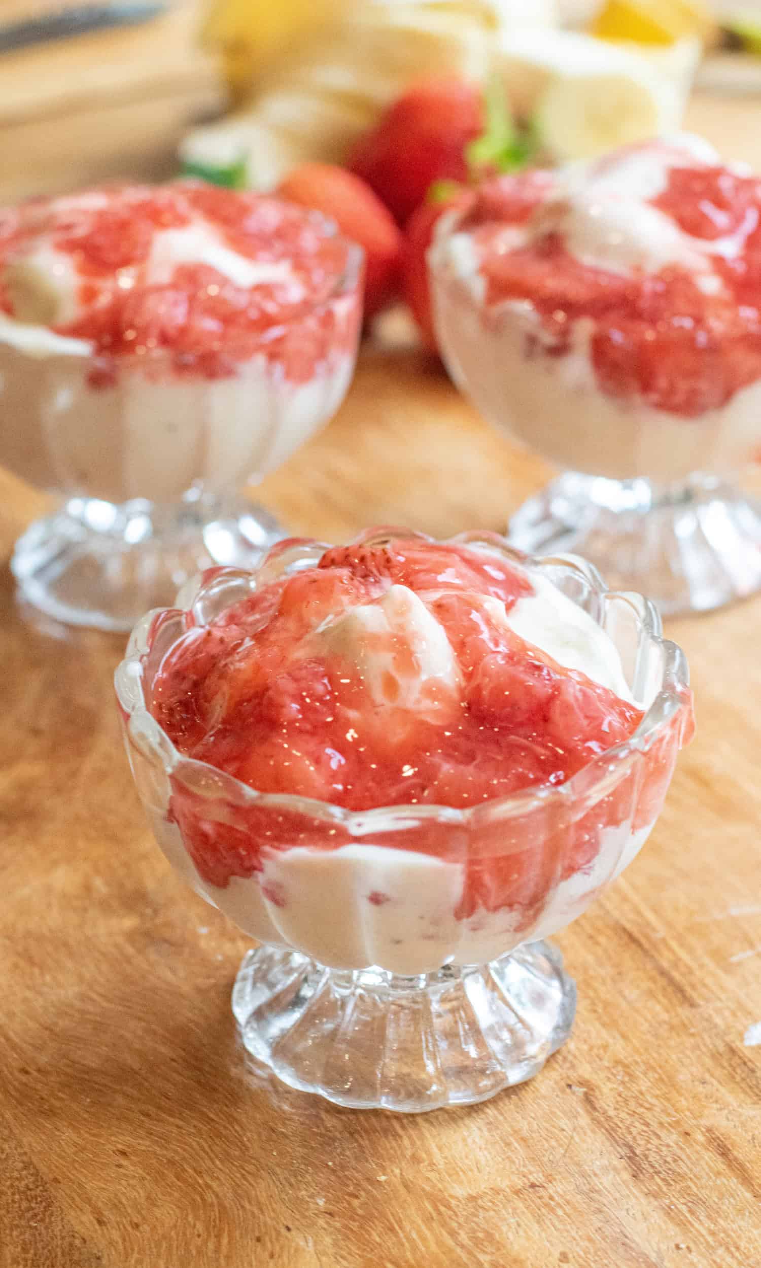 a small bowl of soft serve ice cream with strawberry compote.