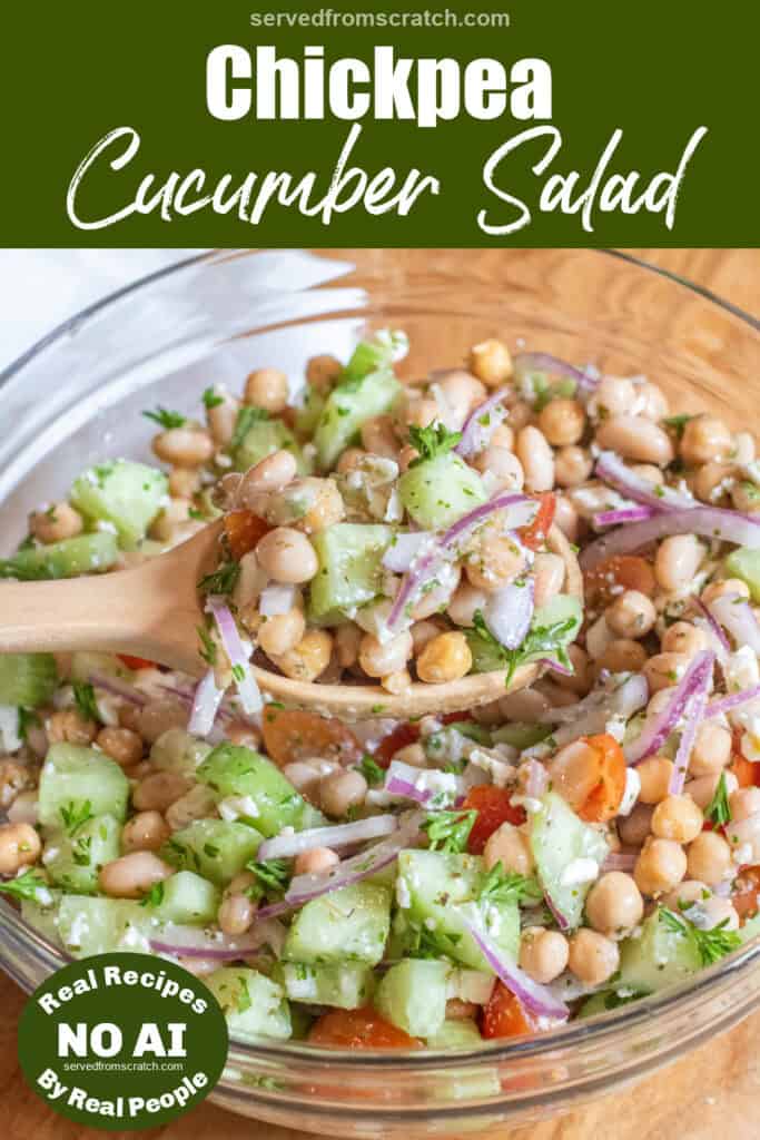 a bowl of chickpeas, beans, cucumber, tomatoes, onions, and feta with a spoonful in a wooden spoon with Pinterest pin text and NO AI sticker.