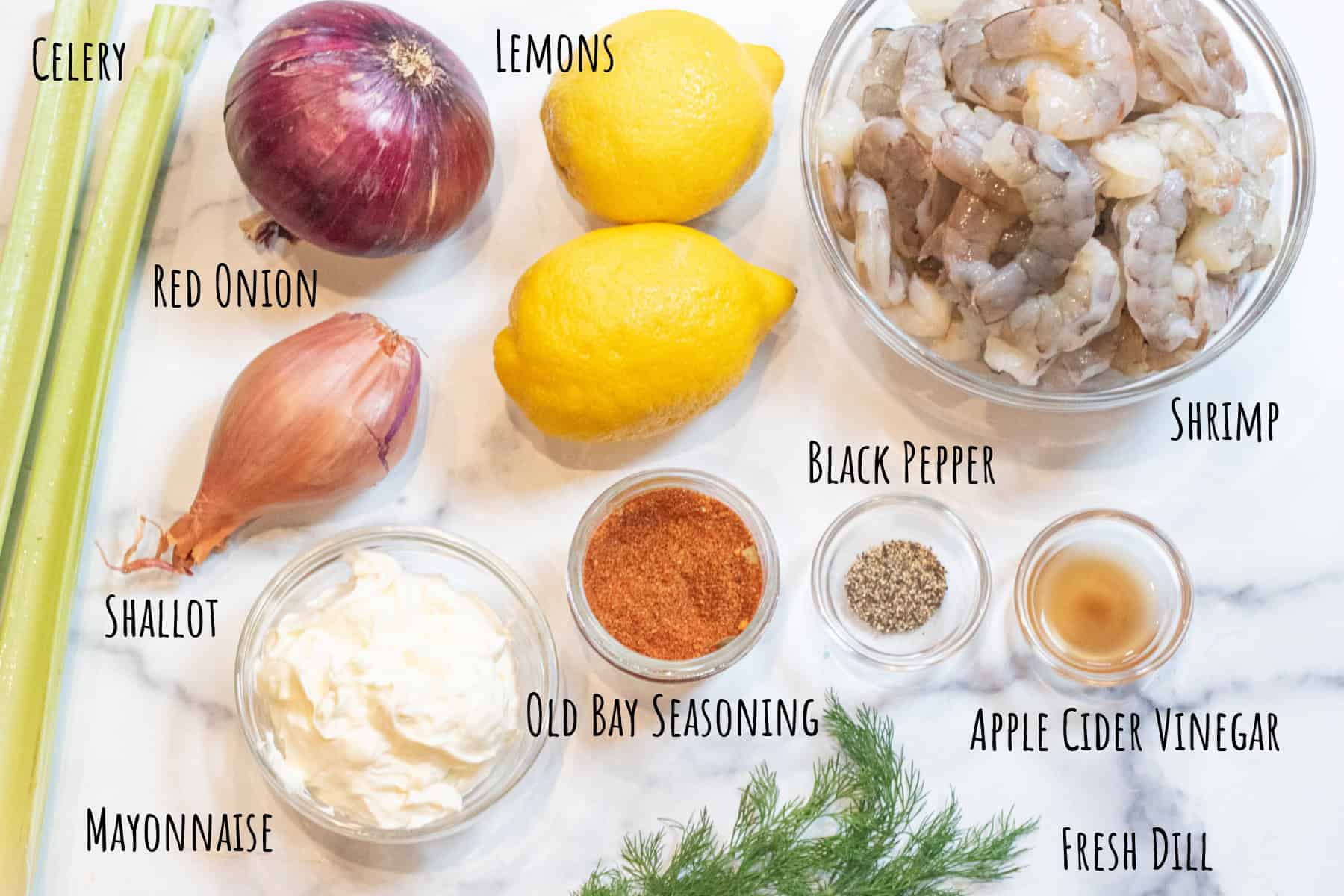 celery, red onion, lemons, shallot, mayonnaise, bowl of raw shrimp, old bay seasoning, pepper, apple cider vinegar, and fresh dill all labeled.