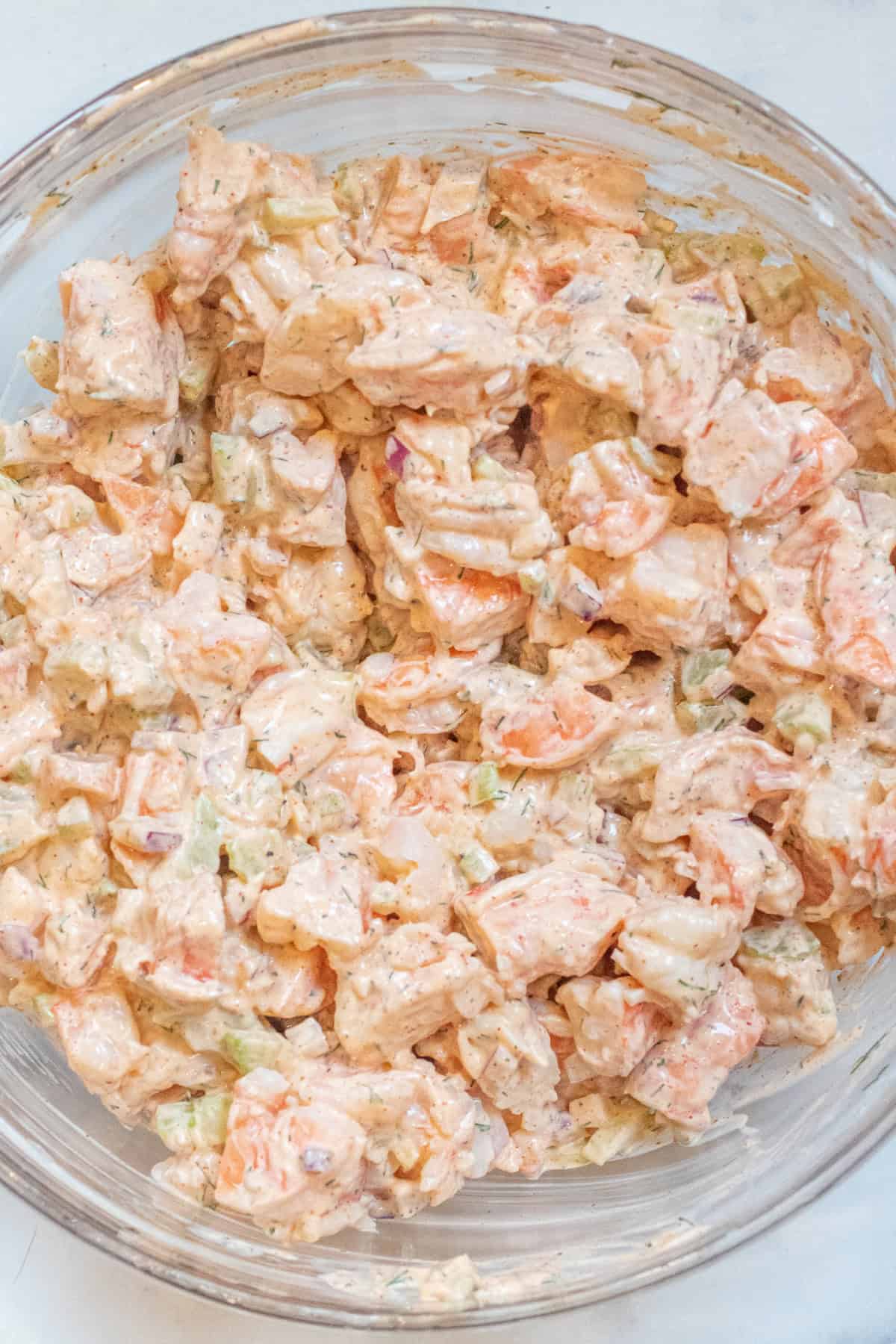 an overhead of a bowl of mixed shrimp salad.